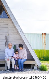 An Elderly Couple On A Leisure Trip With Their Grandchildren