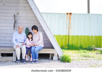 An Elderly Couple On A Leisure Trip With Their Grandchildren