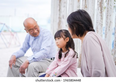 An Elderly Couple On A Leisure Trip With Their Grandchildren