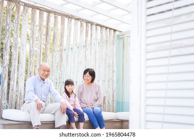 An Elderly Couple On A Leisure Trip With Their Grandchildren