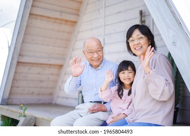 An Elderly Couple On A Leisure Trip With Their Grandchildren