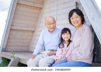 An Elderly Couple On A Leisure Trip With Their Grandchildren