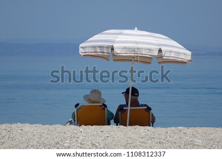 elderly couple on a summer beach                     