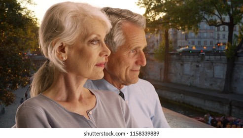 Elderly Couple In Paris Admire The Seine