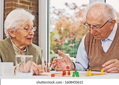Elderly Couple Playing Board Game