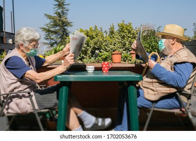 Elderly Couple Reading Newspaper During Coronavirus Epidemic Quarantine