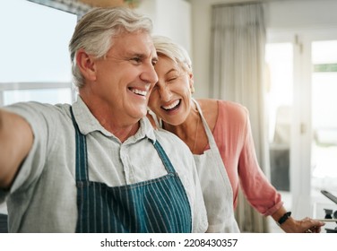 Elderly, couple and selfie in home happy while cooking, baking or cleaning together in funny moment. Older man, woman and retirement laughing in kitchen, bonding and smile, to make food and joke - Powered by Shutterstock