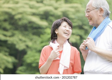 The elderly couple that exercise in the park - Powered by Shutterstock