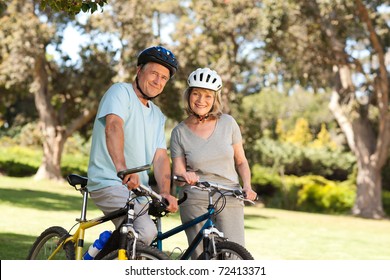 Elderly Couple With Their Bikes