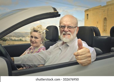 Elderly couple travelling by car