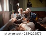 Elderly couple using laptop together at home