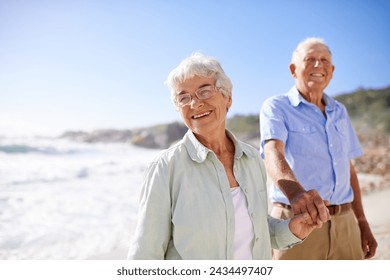 Elderly, couple and walk on beach for portrait on retirement vacation or anniversary to relax with love, care and commitment with support. Senior man, woman and together by ocean for peace on holiday - Powered by Shutterstock