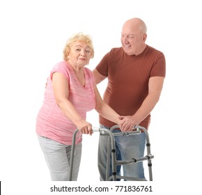 Elderly Couple With Walking Frame On White Background