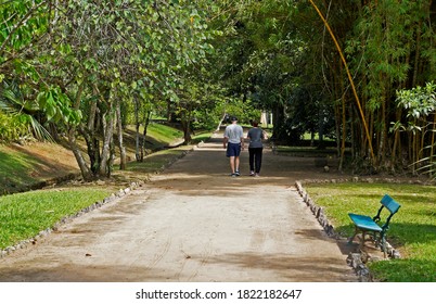 Elderly couple walking on trail in public park, Rio de Janeiro                               
