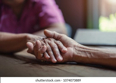 Elderly Couples Are Holding Hands, Concept Of Take Care Together.