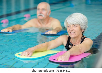 Elderly Doing Aqua Exercises In The Pool