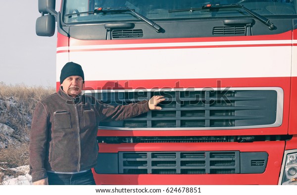 Elderly driver near
big modern truck
outdoors
