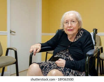 Elderly Eighty Plus Year Old Handicap Woman In A Medical Office Setting.