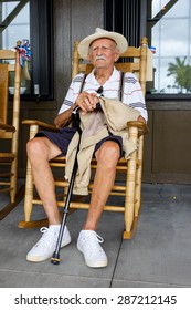 Elderly Eighty Plus Year Old Man Sitting On A Rocking Chair.