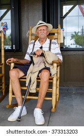 Elderly Eighty Plus Year Old Man Sitting On A Rocking Chair.