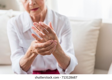 Elderly female is expressing pain - Shutterstock ID 713128687