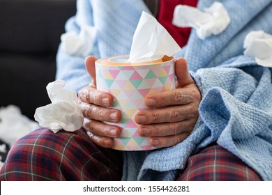 An Elderly Flu Man With Used Handkerchief Around , Cold Virus And Flu Virus Concept With Dirty Napkins