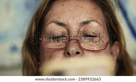 Elderly Gaze - Senior Woman Reads Online Content via Cellphone, Digital Reader, Close-up of Senior Lady Browsing on Mobile with Glasses