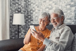 Elderly Grandfather And Grandmother Spend Time Having Fun Using Smartphone Apps, Middle-aged Wife Enjoy Online Entertainments, Taking Selfie With Old Husband, Older Generation And Modern Tech Concept