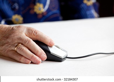 An Elderly Hand On A Computer Mouse