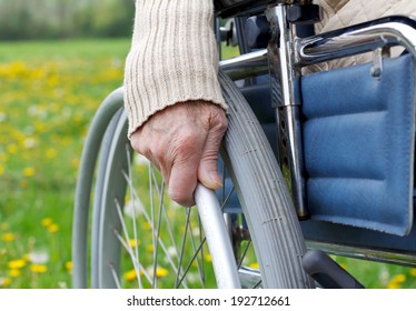 Elderly Handicapped Woman Sitting In A Wheelchair