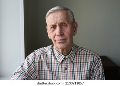 An Elderly Handsome Man Of 80 Years Old, Looking At Camera With A Kind Look And Smiling. Old Cute Grandfather Retired, Positive Emotions Of Mature People.