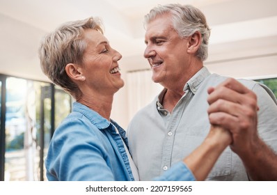 Elderly, Happy And Dancing Couple In Living Room, Enjoying Retirement. Portrait Of Senior Man And Woman Who Dance Together In Their Home, Smiling, Loving And Romantic. Family, Love And Fun Old People