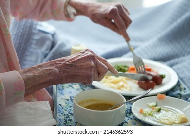 Elderly Lady Eating Healthy Lunch In Bed. Old Age Home. Frail Care. Vegetables. Sausage. Soup.