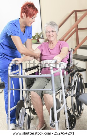 Similar – Doctor talking to elderly patient in a wheelchair