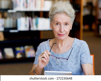 Elderly Lady Working With Tablet