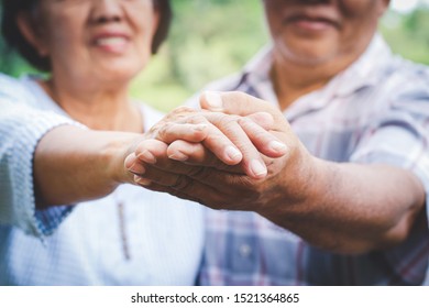 Elderly Lovers Holding Hands Dancing In The Garden Have Fun In Retirement Life. Senior Community Concepts