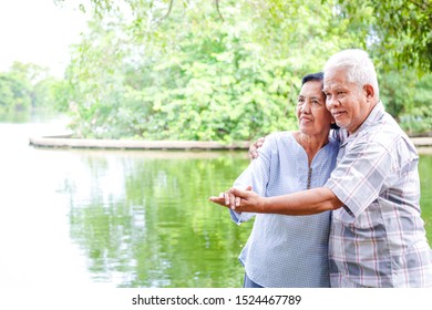 Elderly Lovers Holding Hands Dancing In The Garden Have Fun In Retirement Life. Senior Community Concepts