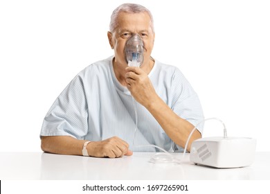 Elderly Male Patient Using An Inhalator Isolated On White Background