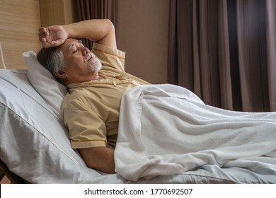 Elderly male patients lie in bed, worried patients, illness in nursing home.Health and Life insurance concept. - Shutterstock ID 1770692507