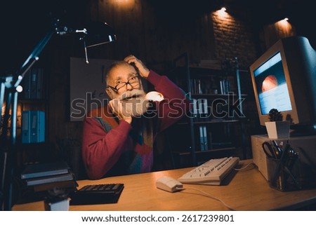 Elderly Male Programmer Researches Coding Project in His Cozy Home Office at Night Using Vintage Computer Technology