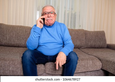 Elderly Man 70-75 Years Old Speak By Phone, His Disappointed, Bad News. Old Male At Home In Sofa. I Miss Family And Friends. Just Wanted To Say Hello