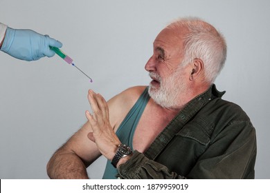 An elderly man is afraid of the corona vaccination and the possible side effects of the immunization.