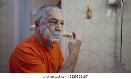 Elderly Man Applying Shaving Foam, Morning Beard Grooming Routine in Bathroom Mirror - Powered by Shutterstock