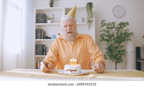 Elderly man celebrates his birthday alone, a reflection of the times amid coronavirus lockdown - Powered by Shutterstock