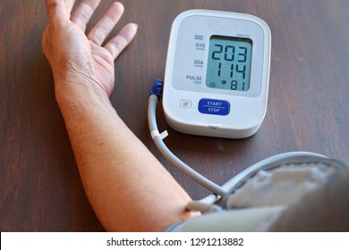 Elderly Man Check Blood Pressure And Heart Rate At Home With Digital Pressure Very High Blood Pressure Test Results.Risk For Cardiology.Need Some Medicine.Health And Medical Concept.