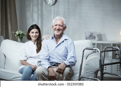 Elderly Man With A Community Nurse Visiting Him