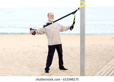 Elderly Man Doing Crossfit Exercise On Fresh Air