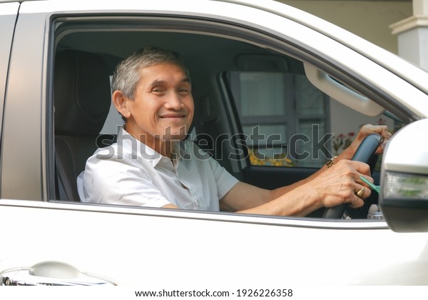the elderly man driving from home, soft focus          \
                 