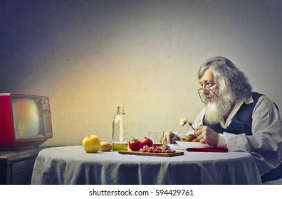 Elderly Man Eating Alone