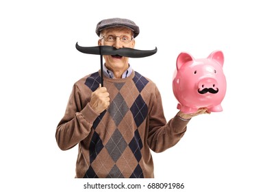 Elderly Man With Fake Moustache Holding A Piggybank With Fake Moustache Isolated On White Background